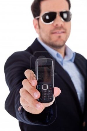6095644-business-man-wearing-sunglasses-and-showing-a-nokia-mobile-on-a-white-background.jpg