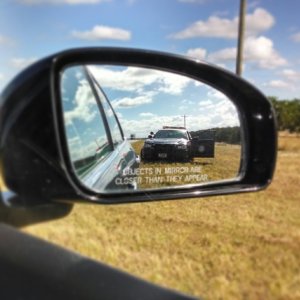Objects_in_mirror_are_closer_than_they_appear.jpg